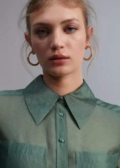 Blusa bolsillos transparencia