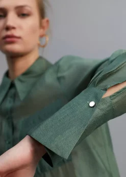 Blusa bolsillos transparencia