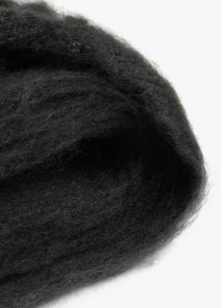 Bufanda con flecos trenzados