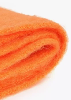 Bufanda con flecos trenzados