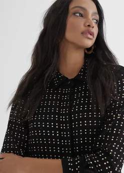 Chaqueta larga con piezas metálicas