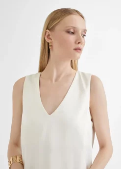 Top largo con aberturas