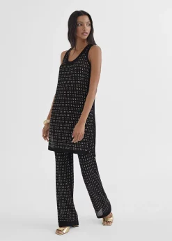 Top largo con piezas metalicas