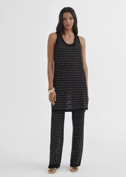 Top largo con piezas metalicas